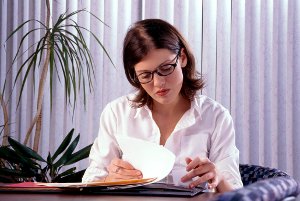 Female psychiatrist looking at a file