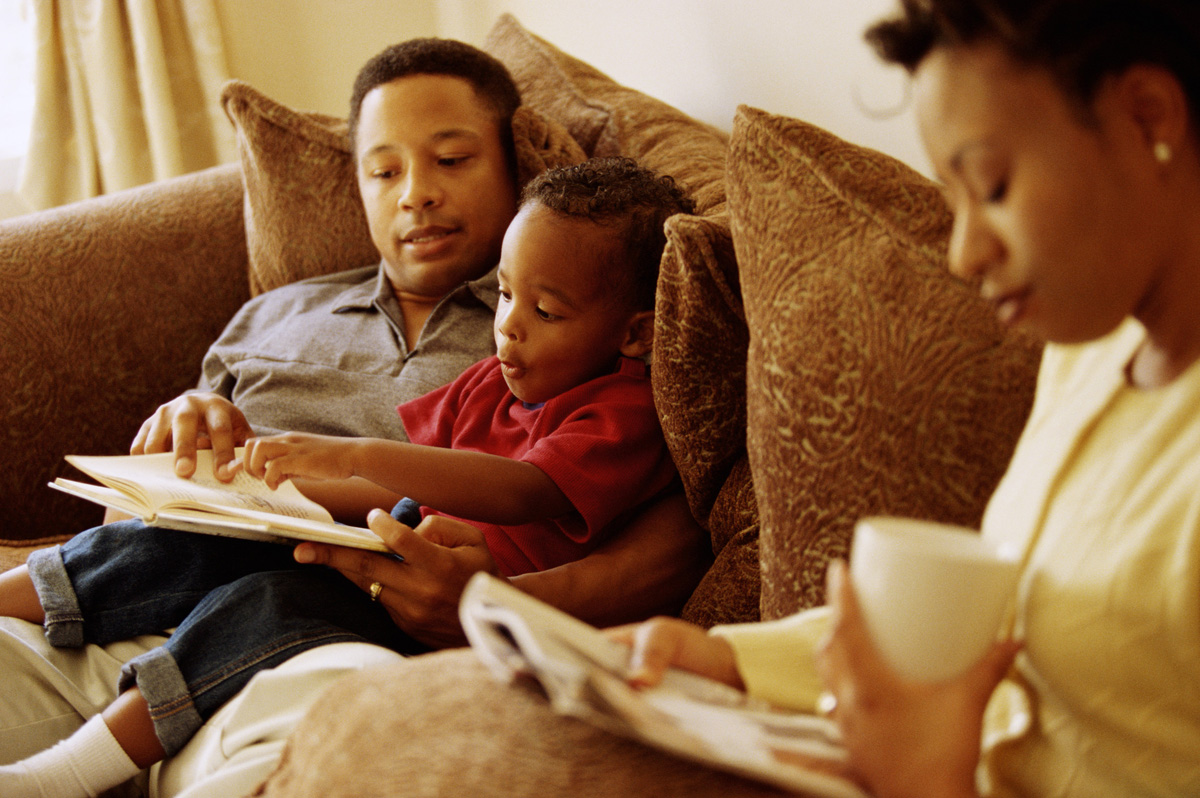 Father and son reading.