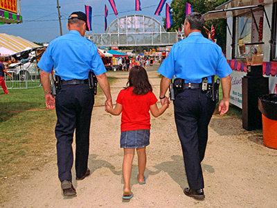 Law enforcement helping child during investigation